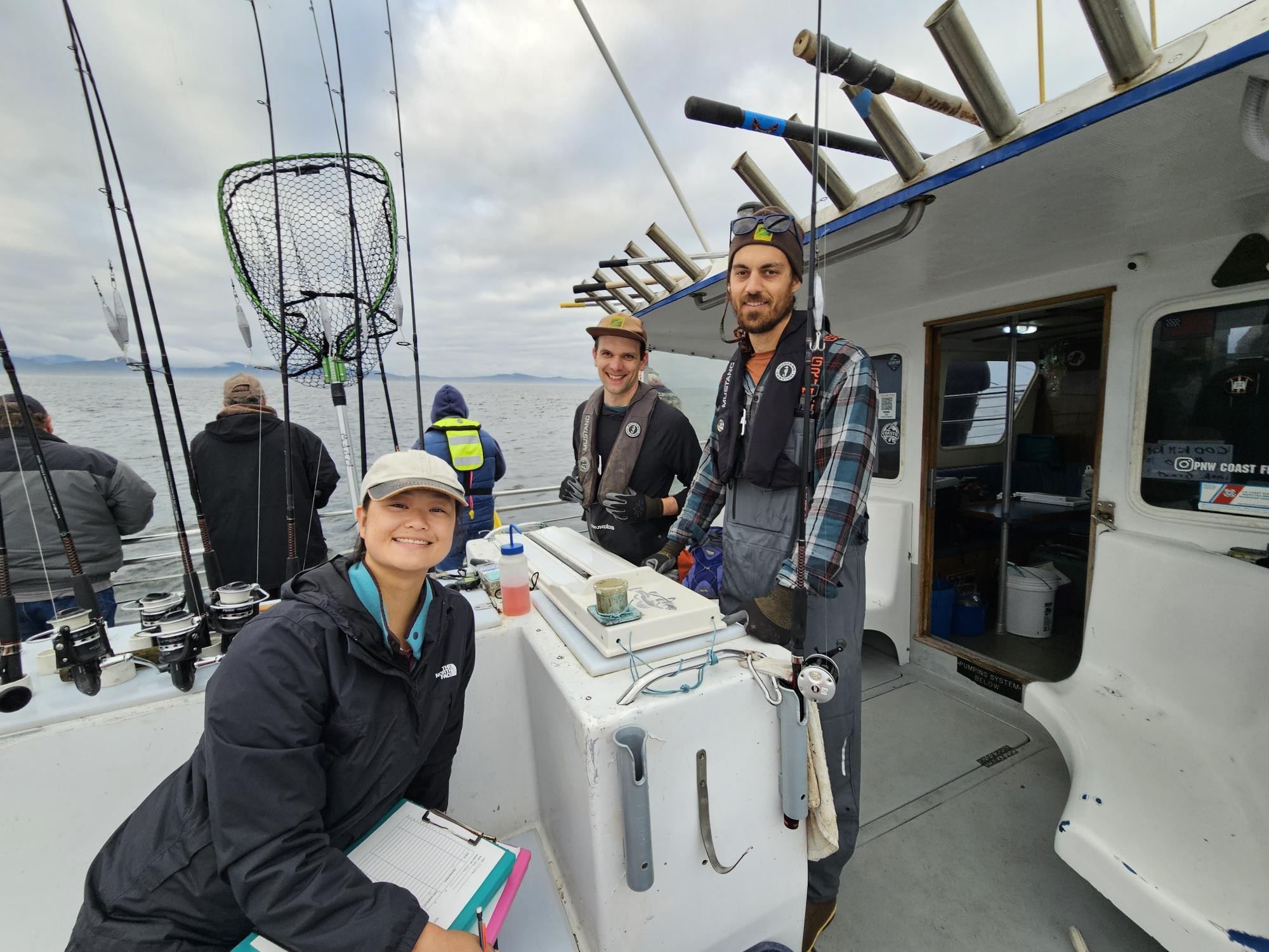 Volunteer biological assistant Laura Jost pictured with Ryan Fields and Dylan Gomes on a Cascade Head Hook-and-Line Survey.